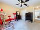Bedroom featuring a neutral carpet, ceiling fan, and dark wood furniture at 2617 Greywall Ave, Ocoee, FL 34761