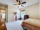Cozy bedroom featuring a ceiling fan, natural light, carpeted flooring, and closet at 2617 Greywall Ave, Ocoee, FL 34761