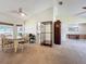 Open concept dining area with view of kitchen and living room at 2617 Greywall Ave, Ocoee, FL 34761