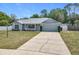 Charming single-story home with a well-manicured lawn and a one-car garage at 2617 Greywall Ave, Ocoee, FL 34761