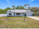 Charming single-story home with a well-manicured lawn and a one-car garage at 2617 Greywall Ave, Ocoee, FL 34761
