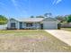 Charming single-story home with a well-manicured lawn and a one-car garage at 2617 Greywall Ave, Ocoee, FL 34761