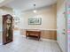Welcoming foyer with tile flooring, wood-paneled walls, and a decorative stained-glass sidelight at 2617 Greywall Ave, Ocoee, FL 34761