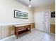Welcoming foyer with tile flooring, wood-paneled walls, and a decorative stained-glass sidelight at 2617 Greywall Ave, Ocoee, FL 34761
