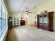 Bright living room with large window, vaulted ceiling, and elegant furnishings at 2617 Greywall Ave, Ocoee, FL 34761