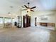 Open living and dining area with vaulted ceiling, natural light, and dining table at 2617 Greywall Ave, Ocoee, FL 34761