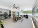 Covered patio with a table, chairs, and grill, perfect for outdoor dining at 2617 Greywall Ave, Ocoee, FL 34761