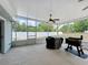 Spacious screened porch featuring a ceiling fan and overlooking the well-maintained backyard at 2617 Greywall Ave, Ocoee, FL 34761