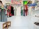 Bright walk-in closet with organized shelving and hanging racks at 2617 Greywall Ave, Ocoee, FL 34761