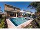 Home featuring a private pool, spa, covered patio, and fenced yard at 291 Pendant Ct, Kissimmee, FL 34747