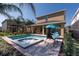Home with pool, spa, patio lounge chairs, and landscaped yard at 291 Pendant Ct, Kissimmee, FL 34747