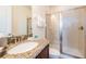 Bathroom with granite countertops, single sink, and glass-enclosed shower at 291 Pendant Ct, Kissimmee, FL 34747
