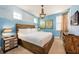 Charming bedroom with unique wood accents, a king bed, and ample natural light at 291 Pendant Ct, Kissimmee, FL 34747