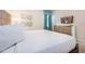 Well-lit bedroom featuring a comfortable bed, stylish dresser, and mounted television at 291 Pendant Ct, Kissimmee, FL 34747