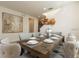 Dining room with seating for eight, featuring a farmhouse-style wooden table with upholstered chairs at 291 Pendant Ct, Kissimmee, FL 34747