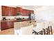 A stylish kitchen with granite countertops, stainless steel appliances, and island with seating at 291 Pendant Ct, Kissimmee, FL 34747
