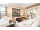Comfortable living room with plush white sofas, stylish decor, and a mounted TV for entertainment at 291 Pendant Ct, Kissimmee, FL 34747