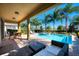 Enjoy the outdoors with this covered lanai overlooking a refreshing pool, spa, and tropical landscaping at 291 Pendant Ct, Kissimmee, FL 34747