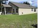 The backyard includes a screened-in porch and a well maintained lawn at 3020 Norlina St, Deltona, FL 32738