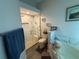 Bathroom featuring a modern walk-in shower with white marble tile, a soaking tub and wood-look tile flooring at 3020 Norlina St, Deltona, FL 32738