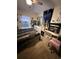Cozy bedroom with carpet, a large bed, and stylish decor at 3020 Norlina St, Deltona, FL 32738