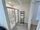 Modern bathroom featuring a glass enclosed shower and a towel rack at 3024 Meleto Blvd, New Smyrna Beach, FL 32168