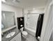 Modern bathroom featuring granite countertop, white cabinets, shower-tub combo, and tiled floors at 3024 Meleto Blvd, New Smyrna Beach, FL 32168