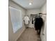 Walk-in closet with ample storage and a window for natural light at 3024 Meleto Blvd, New Smyrna Beach, FL 32168