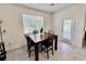 Bright dining area with a modern table set and large windows allowing for natural light at 3024 Meleto Blvd, New Smyrna Beach, FL 32168