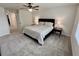 Spacious main bedroom featuring carpet flooring, a ceiling fan, and lots of natural light at 3024 Meleto Blvd, New Smyrna Beach, FL 32168