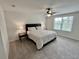 Serene main bedroom with a comfortable bed and a ceiling fan at 3024 Meleto Blvd, New Smyrna Beach, FL 32168