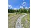 Outdoor crushed shell walking path surrounded by green space and trees at 3024 Meleto Blvd, New Smyrna Beach, FL 32168