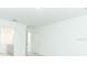 Bright bedroom featuring neutral paint, carpet flooring and an ensuite bathroom at 326 Wayland Dr, Haines City, FL 33844