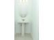 Bright powder room featuring a pedestal sink, neutral paint, and simple fixtures at 326 Wayland Dr, Haines City, FL 33844