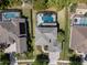Aerial view of a home with a screened-in pool and well-maintained landscaping at 3428 Deer Oak Cir, Oviedo, FL 32766
