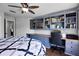 Bright bedroom featuring custom built-ins and a functional work space with modern decor at 3428 Deer Oak Cir, Oviedo, FL 32766