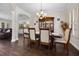 Lovely dining room featuring hardwood floors, a china cabinet, and a view of the kitchen at 3428 Deer Oak Cir, Oviedo, FL 32766