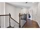 Upstairs hallway featuring dark wood flooring and wrought iron spindles on the stairway at 3428 Deer Oak Cir, Oviedo, FL 32766