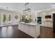 Well-lit kitchen with center island, stainless appliances, and lots of windows at 3428 Deer Oak Cir, Oviedo, FL 32766