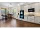 Modern kitchen with stainless steel appliances, granite countertops, and a breakfast nook with natural light at 3428 Deer Oak Cir, Oviedo, FL 32766