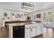 Kitchen with center island and open-concept design connecting to the living and dining areas at 3428 Deer Oak Cir, Oviedo, FL 32766