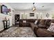 Spacious living room featuring a large sectional sofa, modern lighting, and access to the outdoor space at 3428 Deer Oak Cir, Oviedo, FL 32766