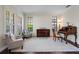 Bright living room with hardwood floors, plantation shutters, and a piano at 3428 Deer Oak Cir, Oviedo, FL 32766