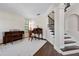 Comfortable living room with hardwood floors, plantation shutters, and a classic writing desk at 3428 Deer Oak Cir, Oviedo, FL 32766