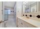 Bathroom featuring a tiled shower and tub combination, along with a well lit vanity at 412 Stimson St, Orlando, FL 32839