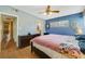 Comfortable bedroom with a ceiling fan, natural light, and light wood flooring at 412 Stimson St, Orlando, FL 32839