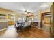 Bright dining area featuring wood floors, white chairs, and stylish ceiling fan at 412 Stimson St, Orlando, FL 32839