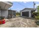 Driveway with a detached two car garage and screened in porch area at 412 Stimson St, Orlando, FL 32839