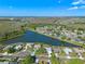 Aerial view of home showcasing lake, landscaping, community and neighborhood at 4229 Settlers Ct, St Cloud, FL 34772