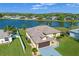 Aerial view of home showcasing lake view, landscaping, and neighborhood at 4229 Settlers Ct, St Cloud, FL 34772